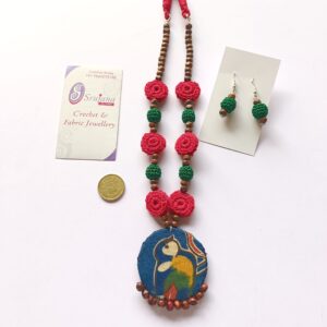 Crochet necklace with fabric pendant